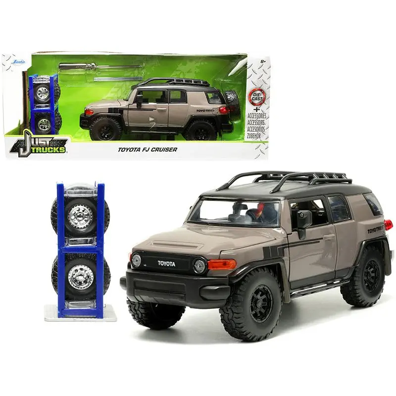 Toyota FJ Cruiser with Roof Rack Brown and Black "Toyo Tires" with Extra Wheels "Just Trucks" Series 1/24 Diecast Model Car by Jada